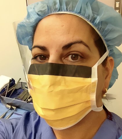 Dr. Kathryn Hughes in a surgical cap and mask, from her blog Behind the Mask